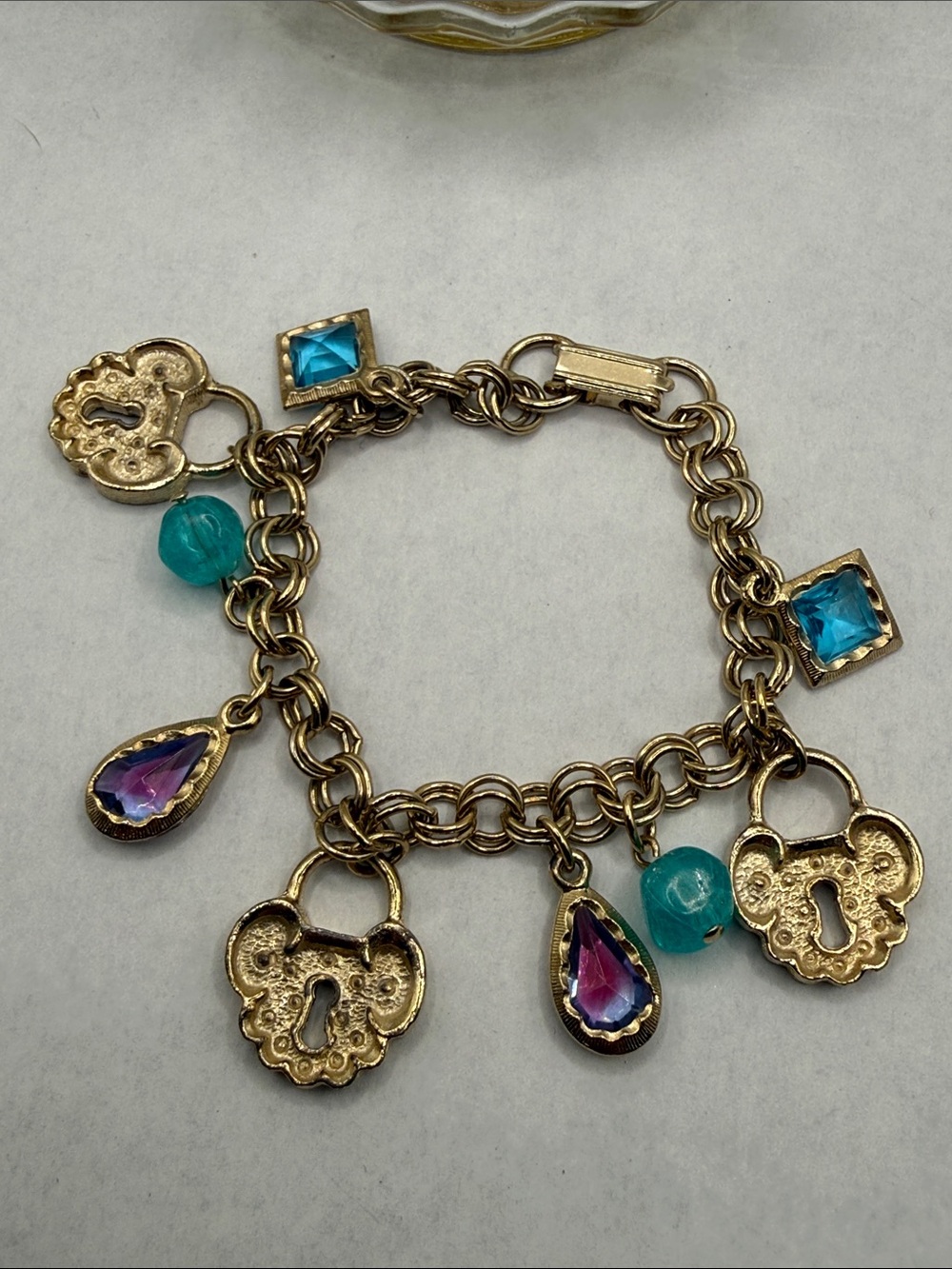 Whimsy Gold-Tone Charm Bracelet with Aqua Beads and Purple Teardrops lock & key